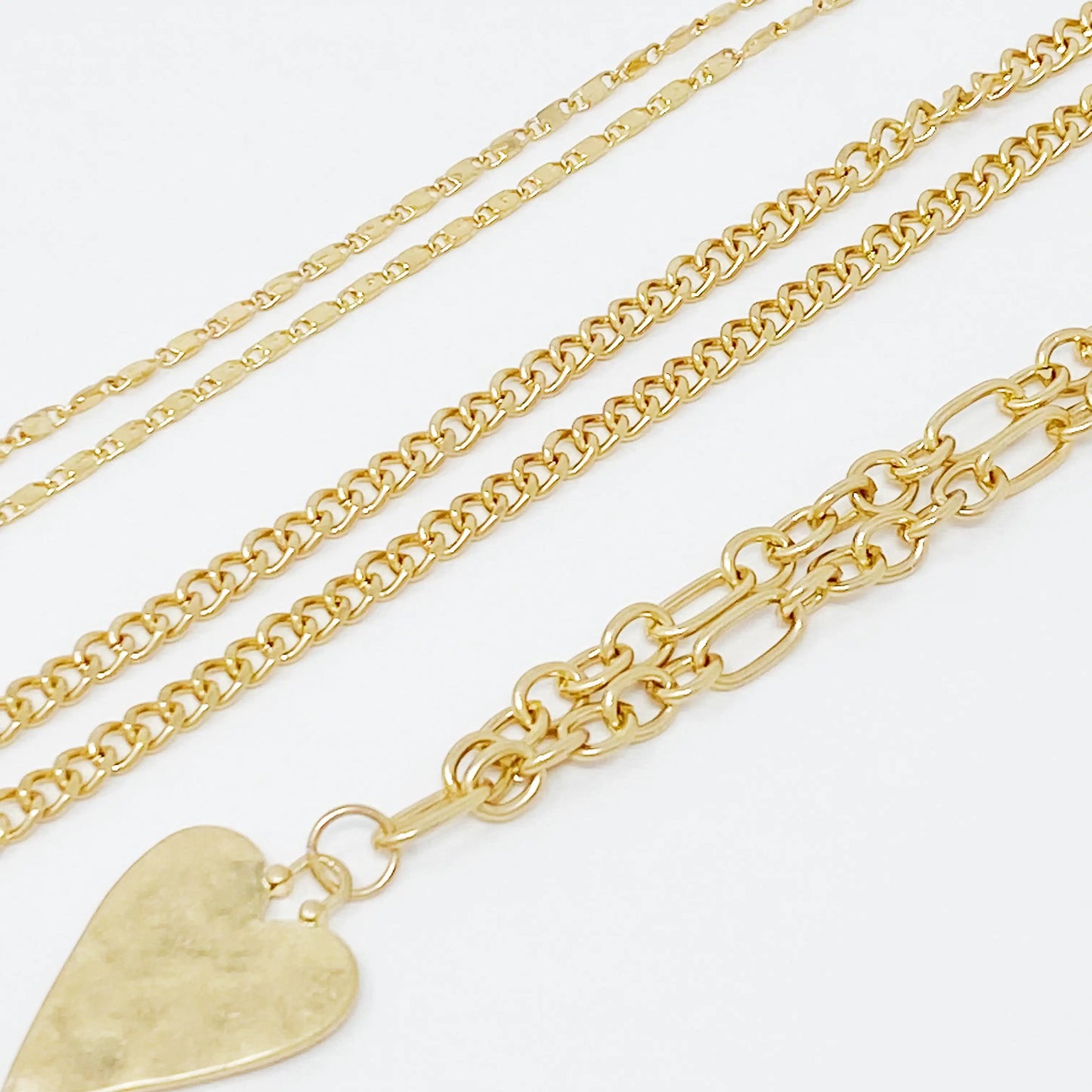 Heart Charm Layered Chain Necklace – Set van 3 Kettingen met Gehamerd Hart